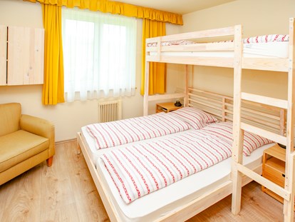 Familienhotel - Umgebungsschwerpunkt: Strand - Doppelzimmer Typ "Schneekönig" mit Etagenbett - Familienhotel Schneekönig